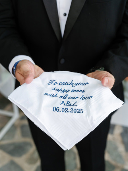 Custom embroidered handkerchief reading “To catch your happy tears…” with wedding date