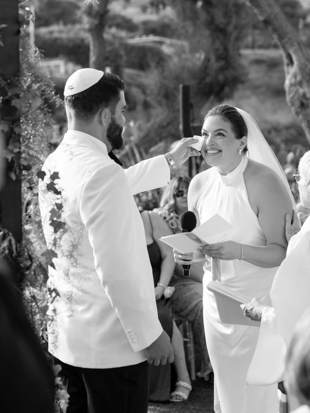 Joyful black-and-white portrait capturing bride’s candid reaction