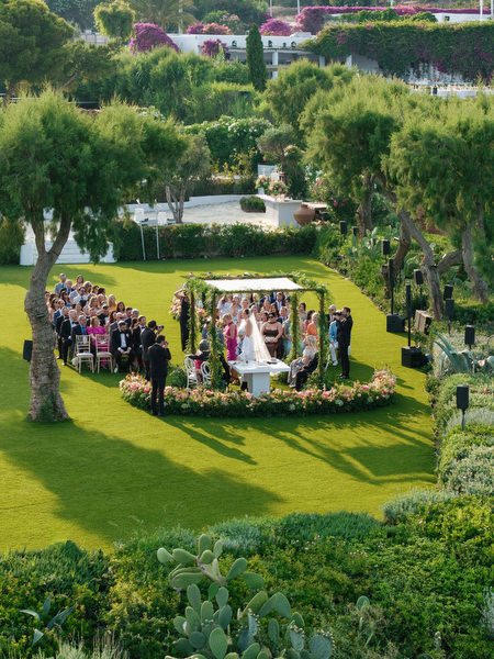 Overhead perspective of chuppah centered on the lawn overlooking the Athenian Riviera at Island Residence