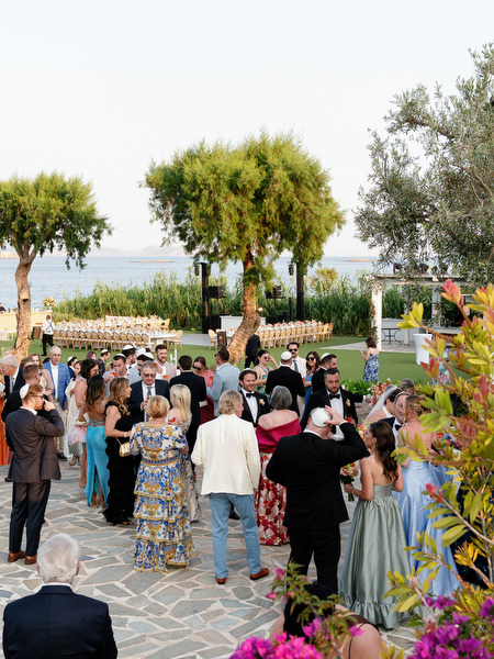 Friends and family mingling on the terrace overlooking the Mediterranean at Island Residence