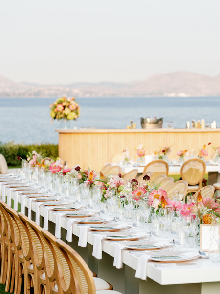 Cocktail bar styled with florals overlooking the Mediterranean at Island Residence