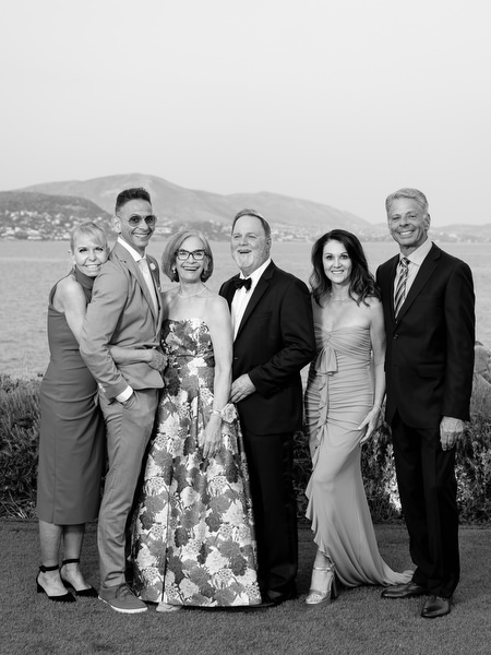 Multi-generational family portrait framed by the sea