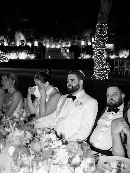 Bride wiping away tears while listening to a speech at Island Residence
