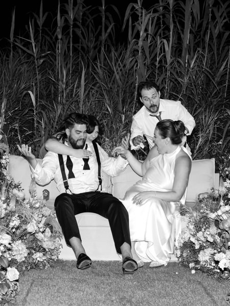 Friends joking together on the lounge seating at Island Residence