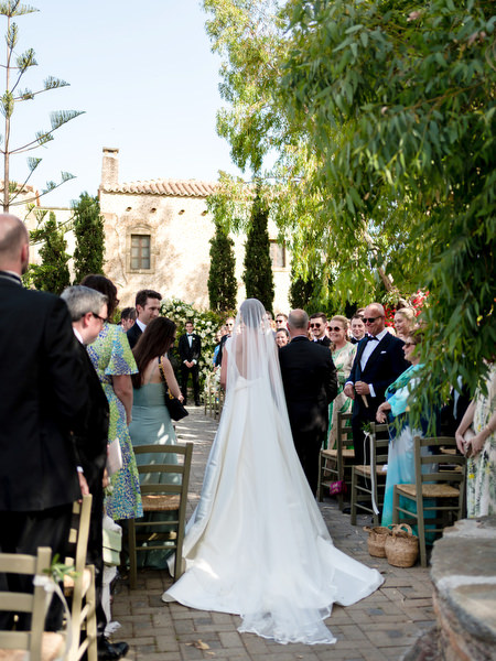 Bride entering ceremony at Kinsterna Hotel Monemvasia.