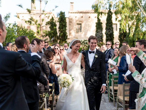 Bride and groom exiting ceremony at luxury wedding Kinsterna Hotel.