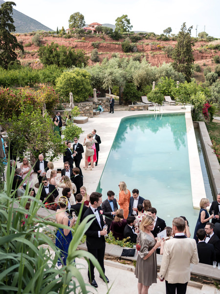 Cocktail hour by the pool at Kinsterna Hotel Monemvasia wedding.