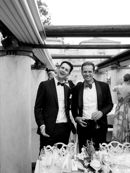 Candid groomsmen portrait at Kinsterna Hotel destination wedding.