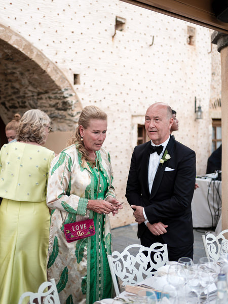 Black-tie wedding guests at Kinsterna Hotel reception.