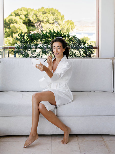 Bride getting ready at Four Seasons Astir Palace before her Athens seaside wedding ceremony