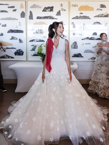 Bride in floral lace ball gown during traditional wedding preparations at Four Seasons Athens