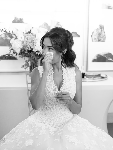 Bride wiping tears during meaningful wedding morning traditions at Four Seasons Astir Palace