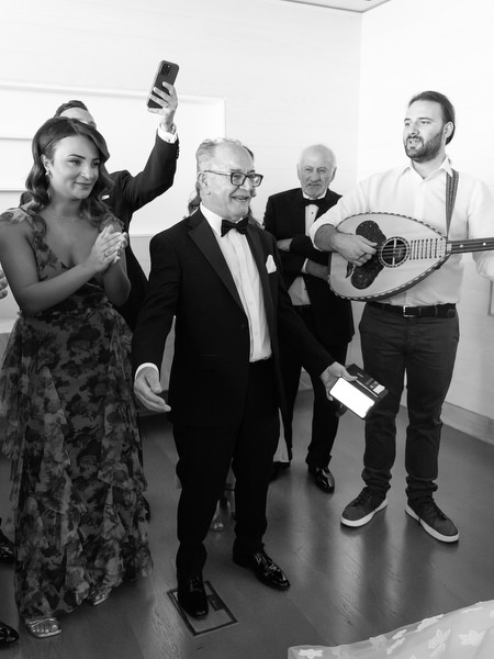 Live musicians performing traditional Cypriot wedding music during morning celebrations in Athens