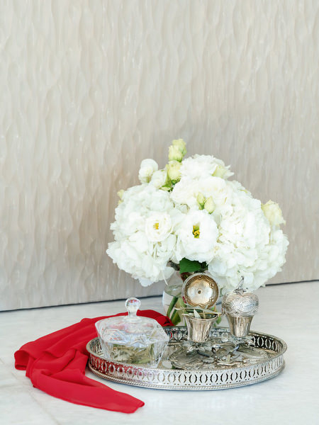 Traditional wedding tray with stefana crowns and red ribbon for a Greek Orthodox ceremony in Athens