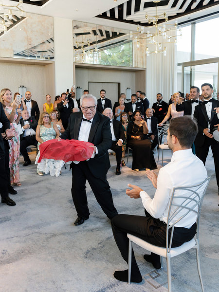 Traditional Cypriot wedding ritual taking place during black-tie celebrations at Four Seasons Athens