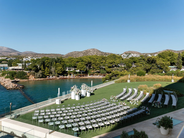 Seaside wedding ceremony setup at Four Seasons Astir Palace overlooking the Aegean Sea