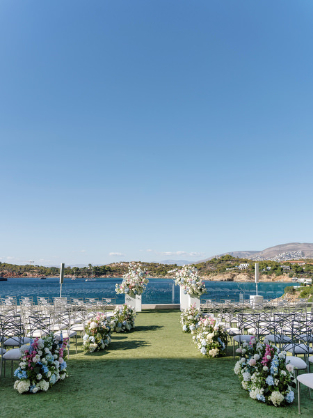 Elegant wedding ceremony seating overlooking the Aegean Sea at Four Seasons Athens