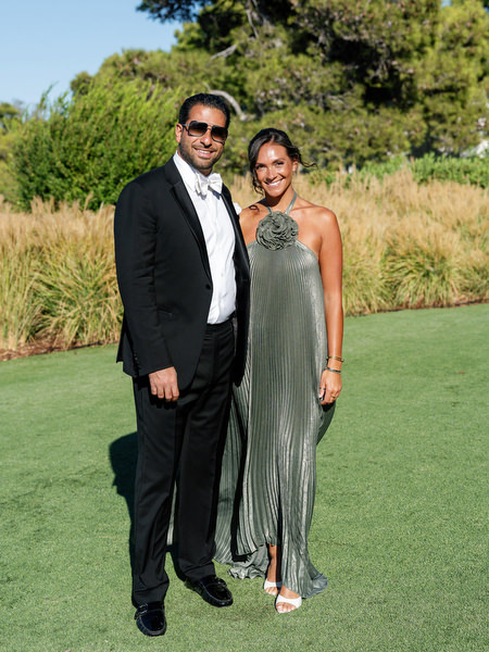Guests posing before a seaside wedding ceremony in Athens