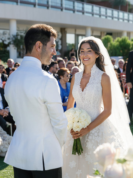 Bride smiling at groom during their Athens Riviera seaside ceremony