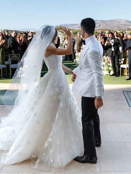 Bride celebrating as newlyweds during a luxury Athens Riviera wedding
