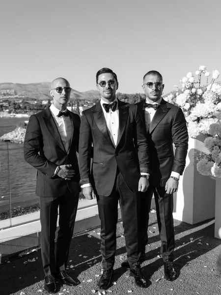 Groomsmen in black-tie attire at a luxury wedding on the Athens Riviera