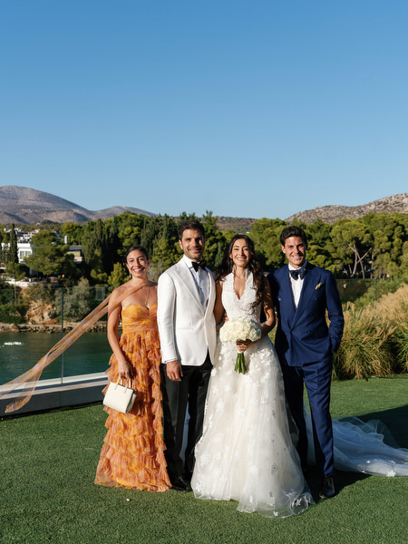 Bride and groom with wedding party at Four Seasons Astir Palace Athens