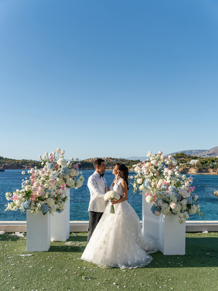 Seaside wedding portraits at Four Seasons Astir Palace overlooking the Aegean Sea