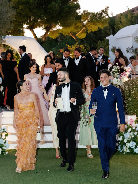 Elegant wedding guests entering Island Resort Athens reception