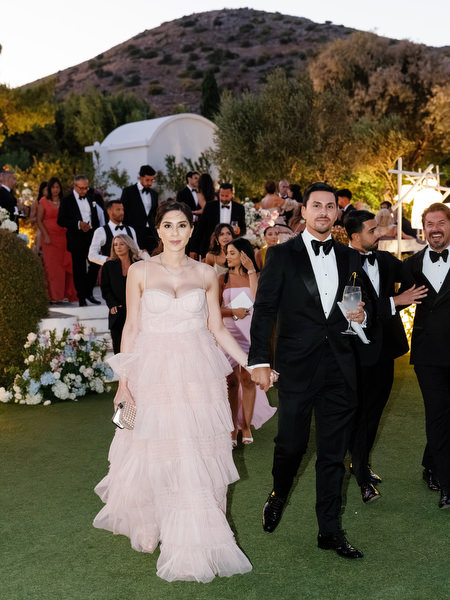 Black-tie guests arriving at Athens Riviera wedding reception