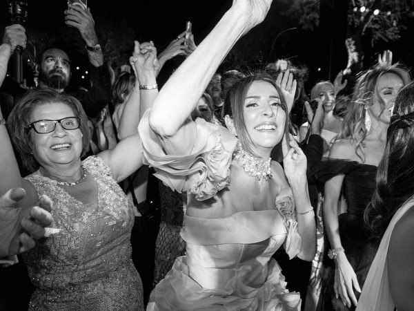 Black-and-white wedding dance floor moment at Island Athens