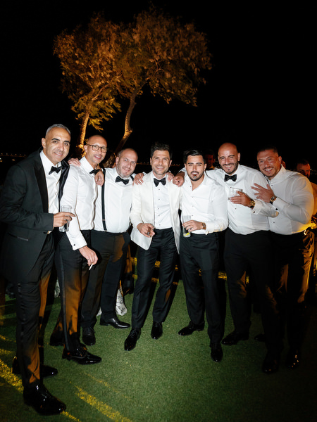 Black-tie wedding guests at Island Resort Athens