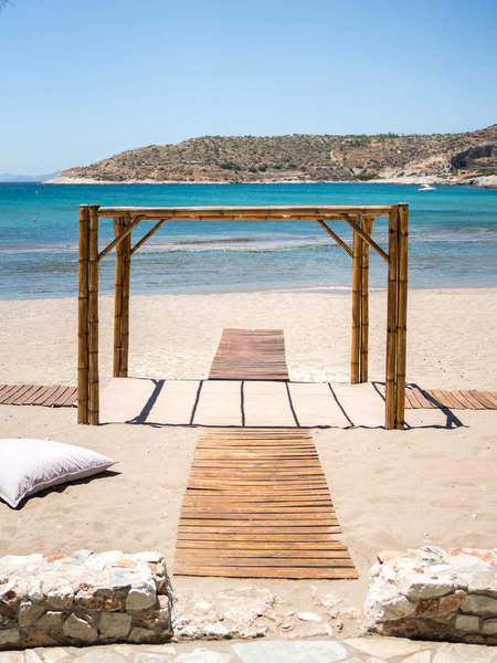 Ceremony arch overlooking the sea at Reef Athens Riviera wedding venue