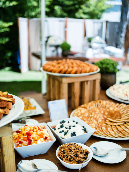 Dessert station with traditional sweets at Indian pre-wedding brunch