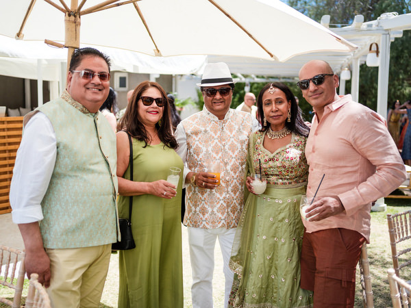 Group portrait of wedding guests during Indian pre-wedding event