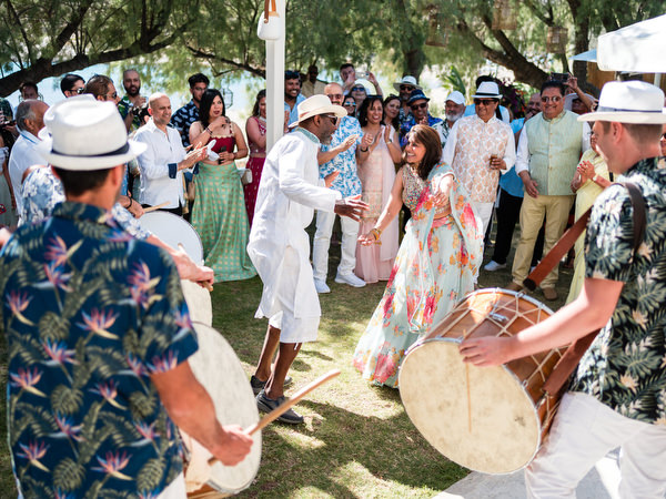 Guests clapping and dancing during Indian wedding festivities
