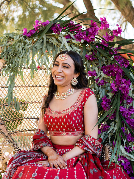 Bride portrait with vibrant floral backdrop