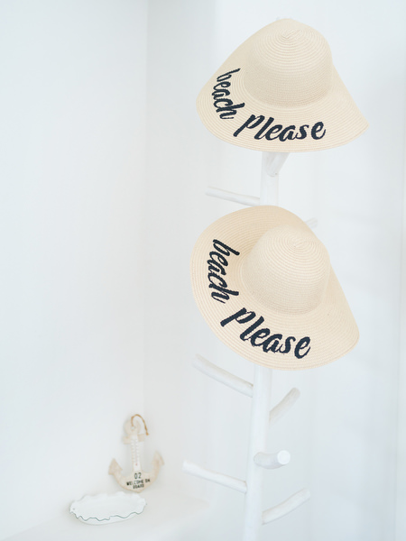 Personalised straw hats for bridesmaids at Paros destination wedding in Greece.