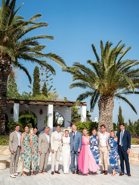 Wedding family group portrait at Petra Farm Paros overlooking the Aegean Sea.