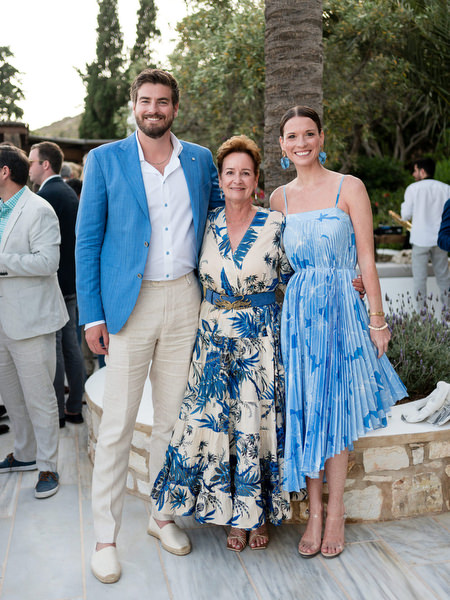 Wedding guests posing for portrait at Petra Farm Paros destination wedding.