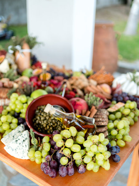 Mediterranean grazing table with grapes, cheese and olives at Petra Farm Paros wedding.