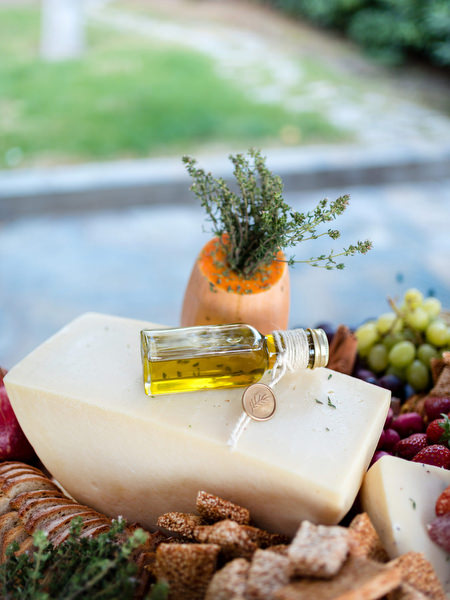Greek cheese and olive oil display at Paros island wedding cocktail hour.