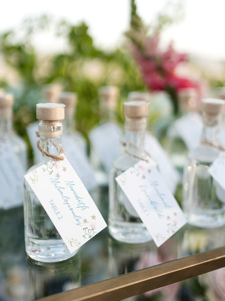 Wedding guests toasting with cocktails during Paros island wedding reception.