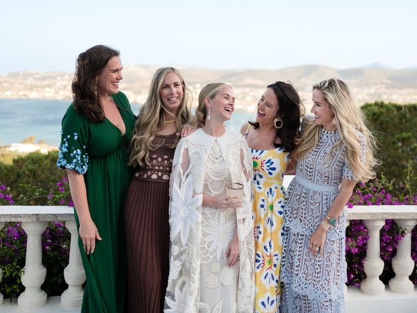 Bride with bridesmaids during sunset cocktail hour at Petra Farm Paros.