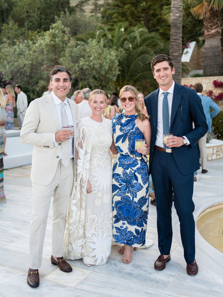 Couple and guests posing during Paros destination wedding reception at Petra Farm.