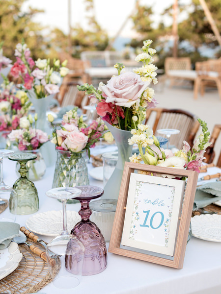 Floral wedding tablescape with pastel flowers at Petra Farm Paros reception.