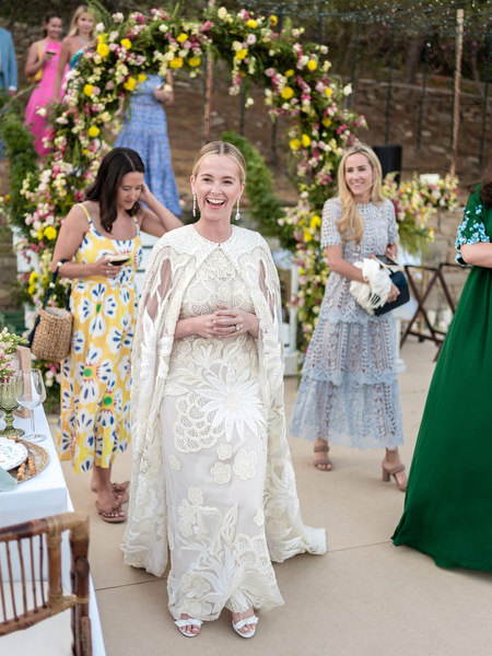 Bride walking into outdoor reception at Petra Farm Paros destination wedding.
