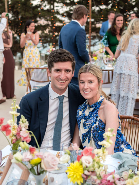 Guests posing at outdoor Paros wedding reception.