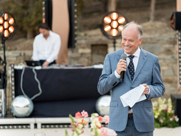 Father giving wedding speech at outdoor reception at Petra Farm Paros.