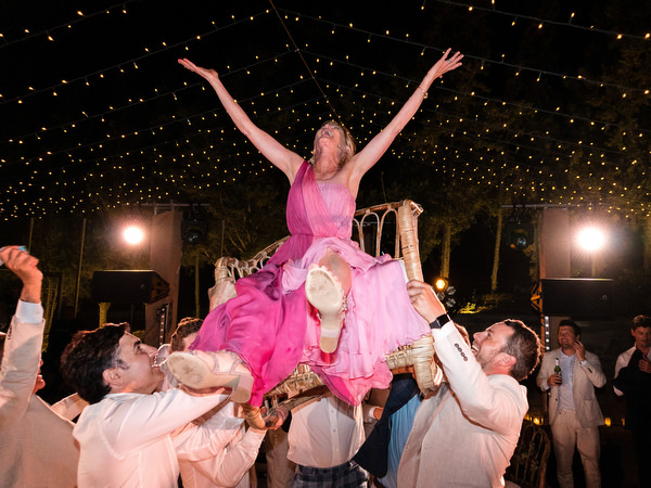 Guests celebrating with sparklers at Petra Farm Paros wedding reception.