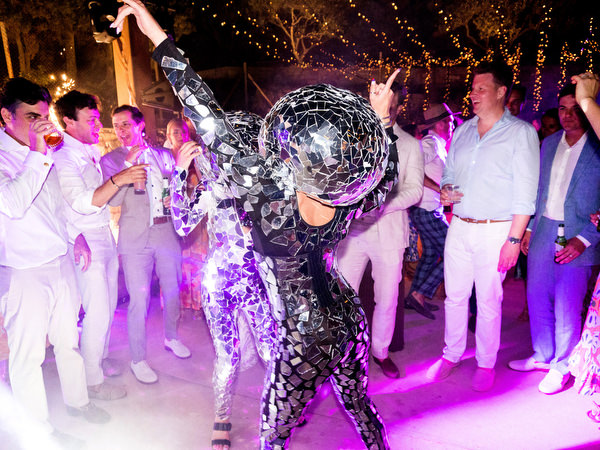 Wedding entertainers dancing at Petra Farm Paros luxury reception.